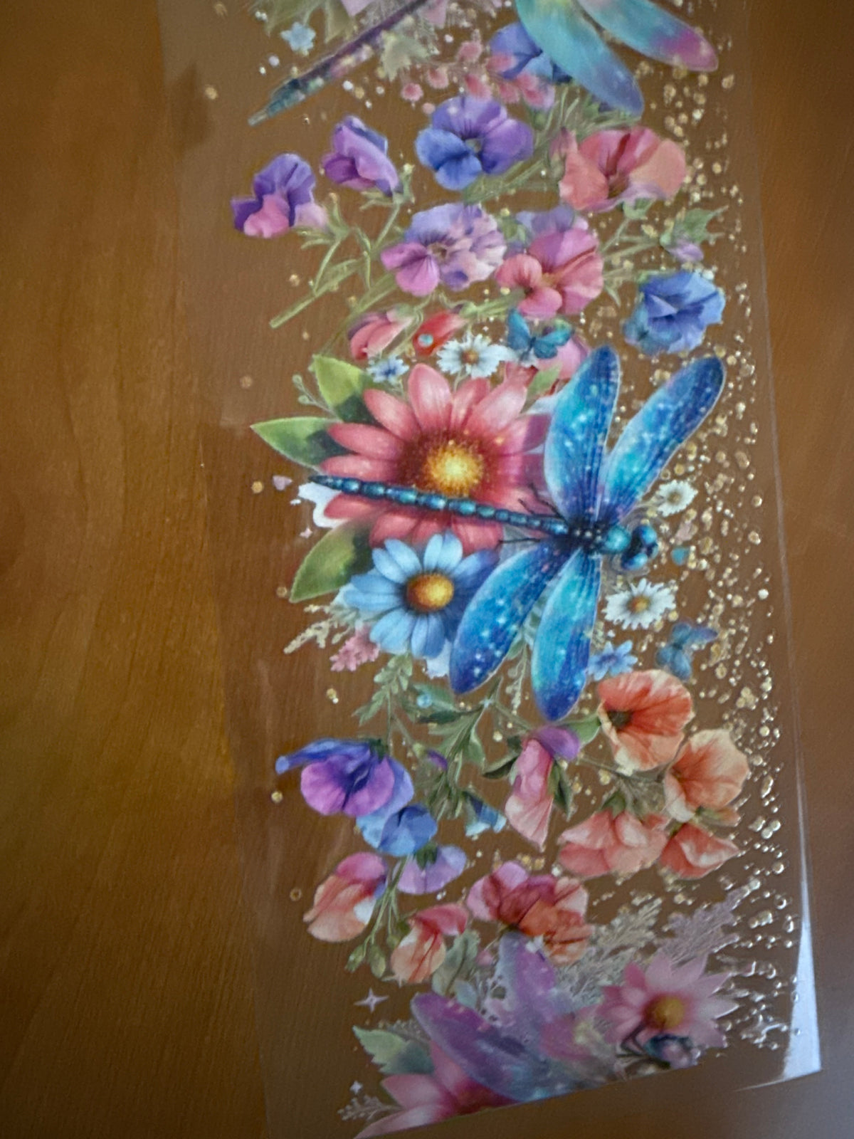 Blue dragonfly with flowers