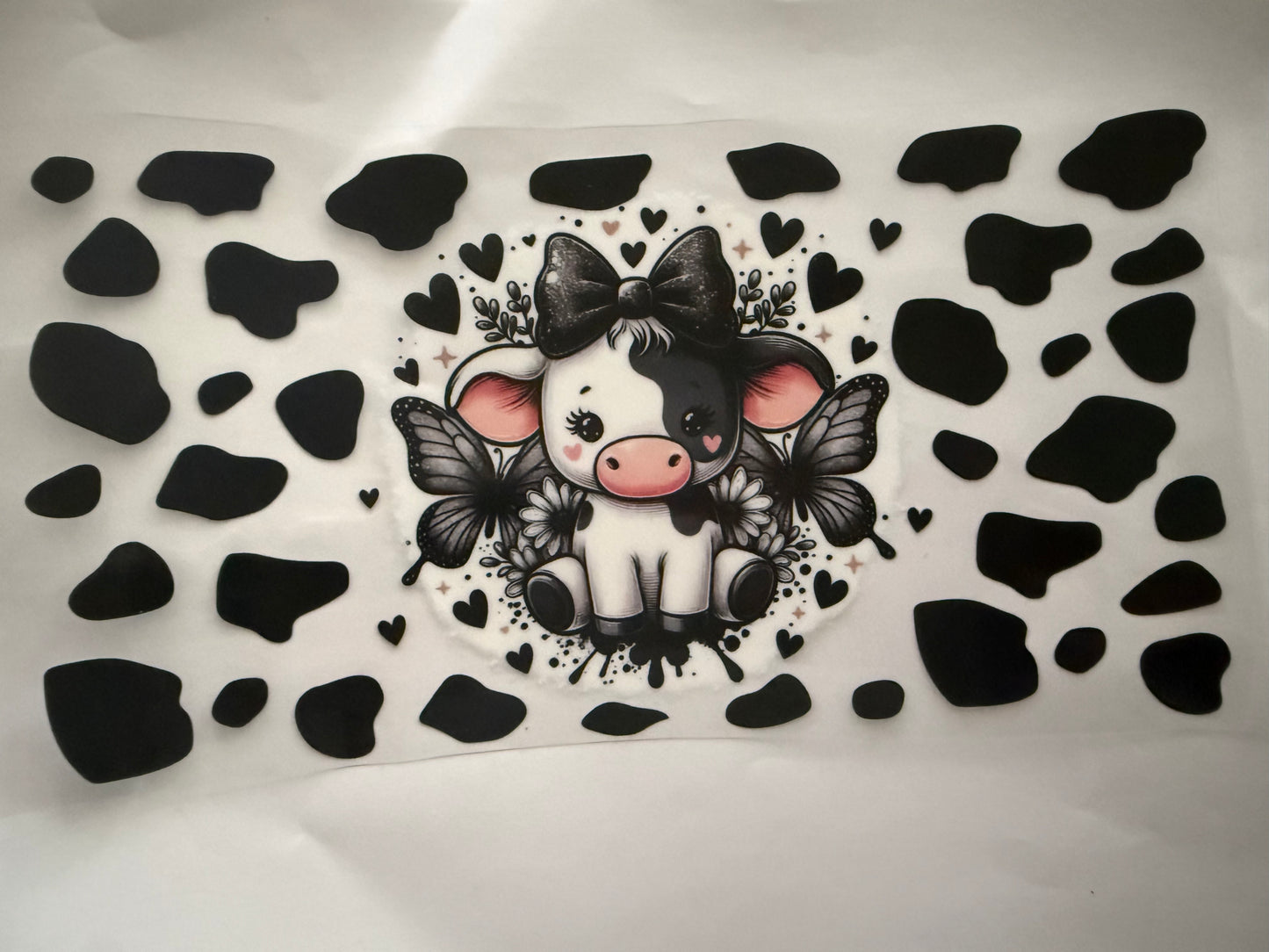 Cow print highland cow with butterflies