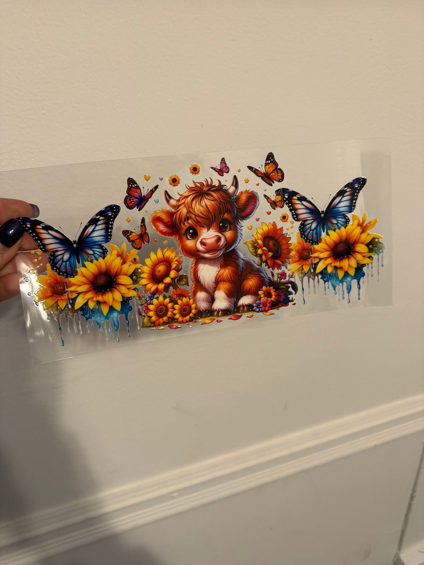 Highland cow with butterflies